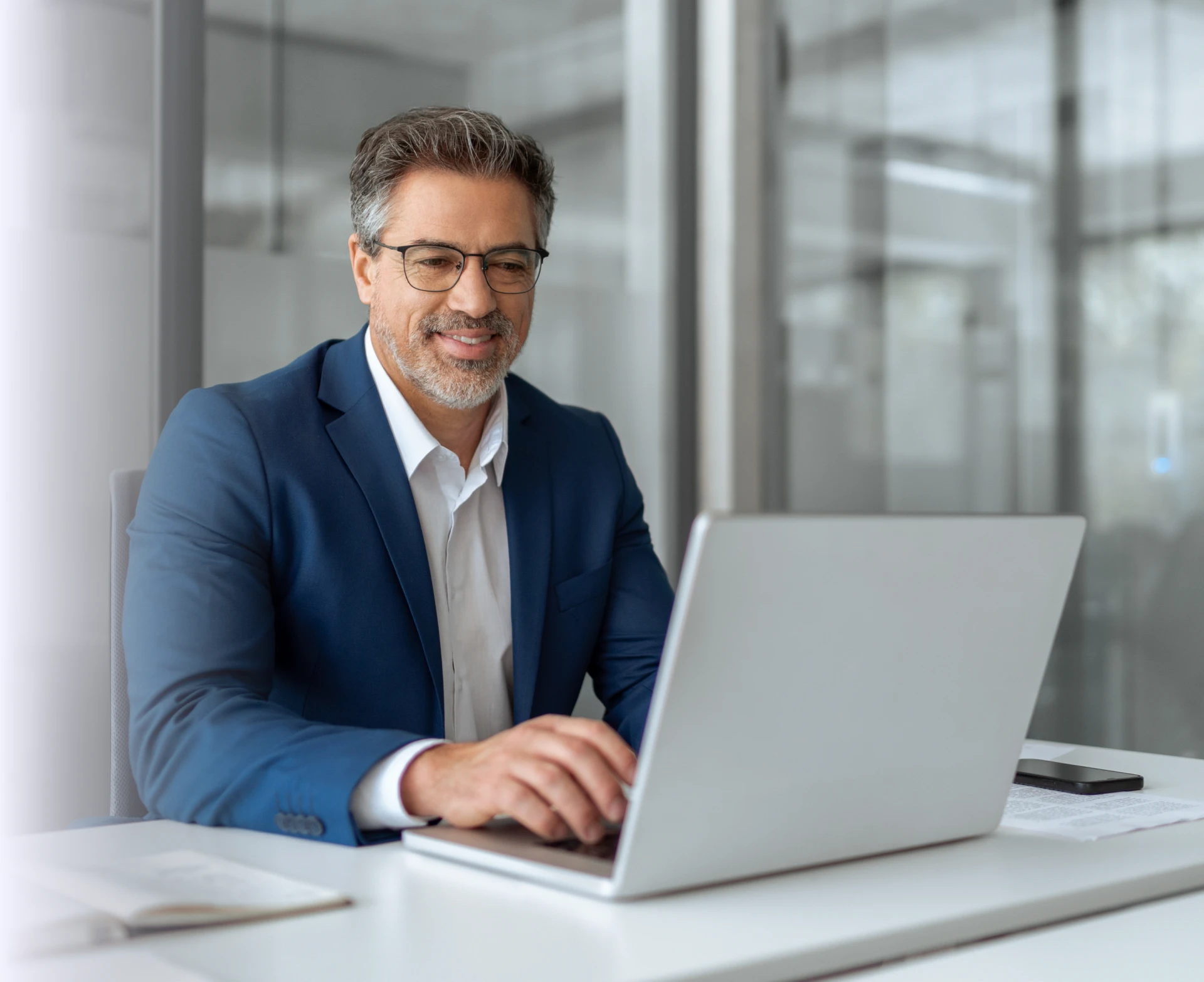 Smiling businessman using computer