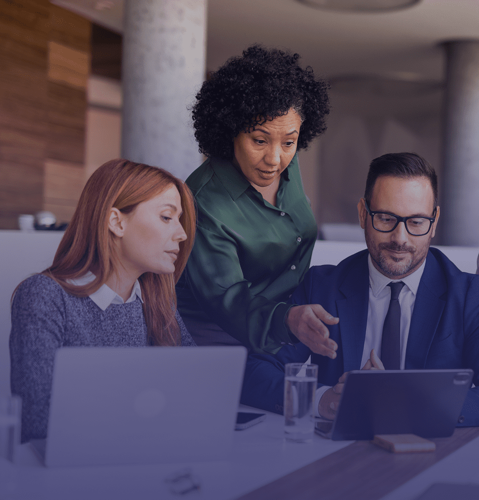 Team discussing work on tablet